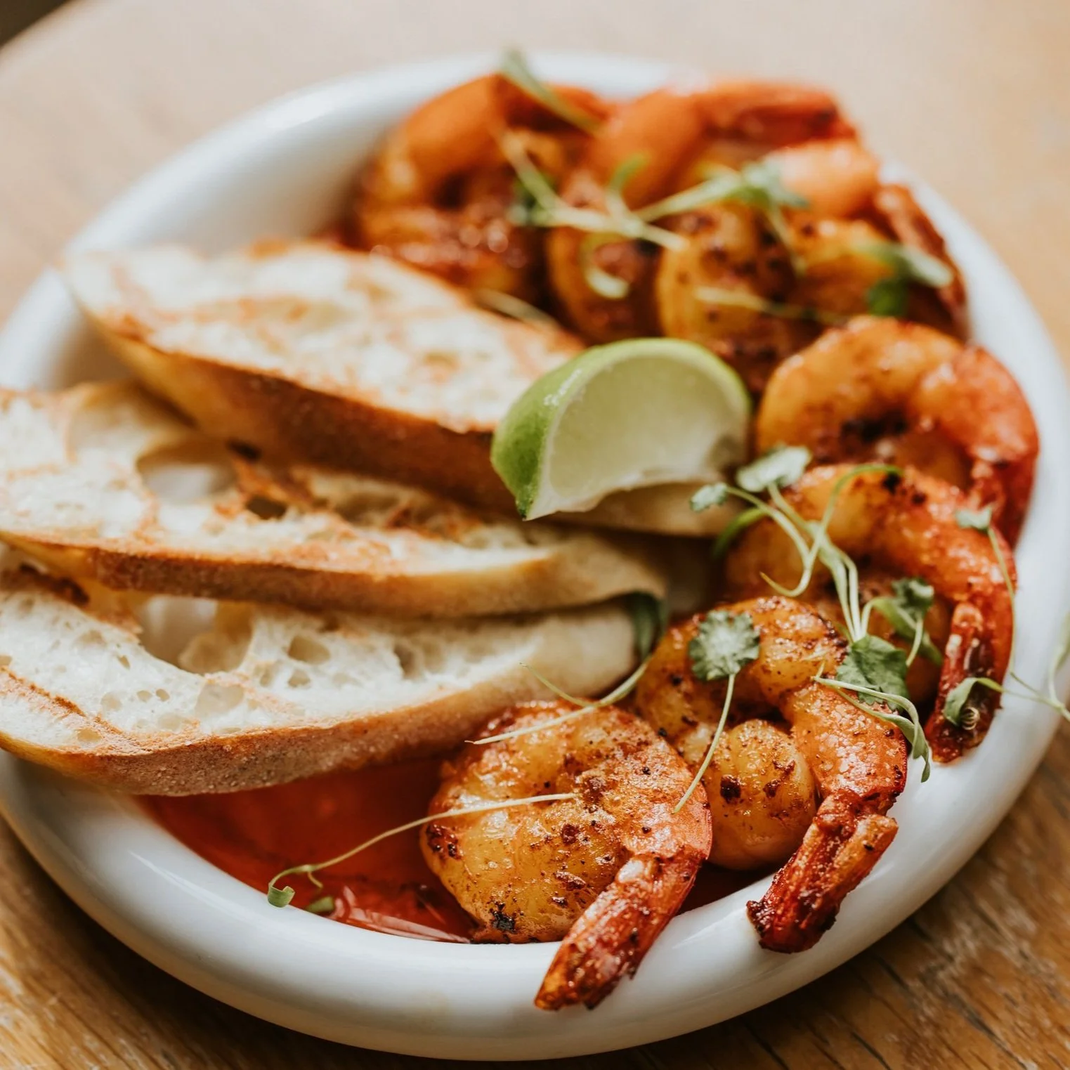 Naive Kitchen + Bar signature dishes Tuna Ceviche Tacos
Garlic Shrimp
Yuca Fry Poutine